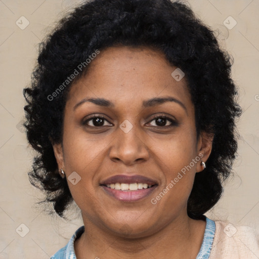 Joyful black young-adult female with long  black hair and brown eyes