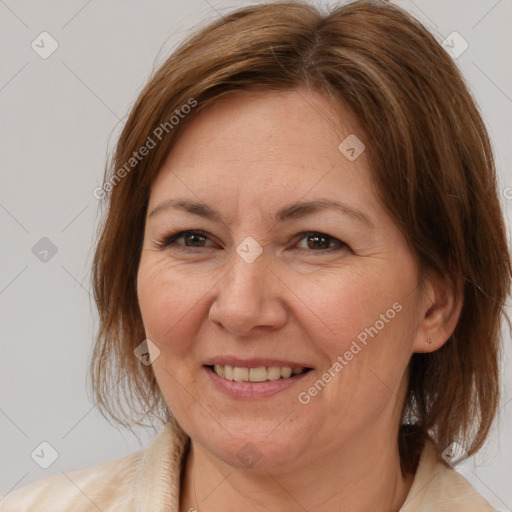 Joyful white adult female with medium  brown hair and brown eyes