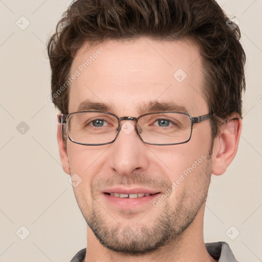 Joyful white adult male with short  brown hair and grey eyes