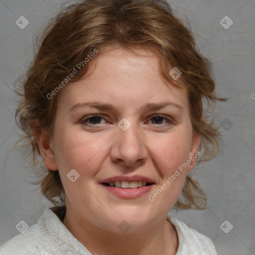 Joyful white adult female with medium  brown hair and blue eyes