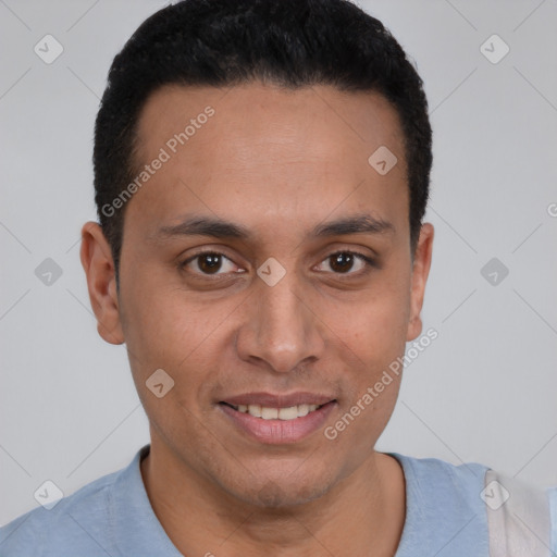 Joyful latino young-adult male with short  black hair and brown eyes