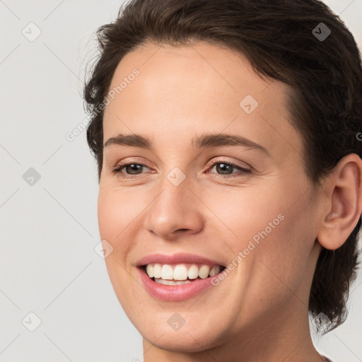 Joyful white young-adult female with medium  brown hair and brown eyes