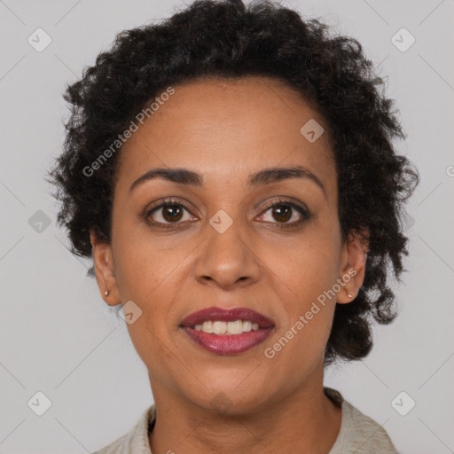 Joyful latino adult female with short  brown hair and brown eyes