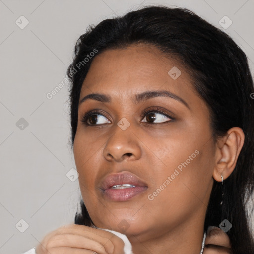 Joyful asian young-adult female with medium  black hair and brown eyes