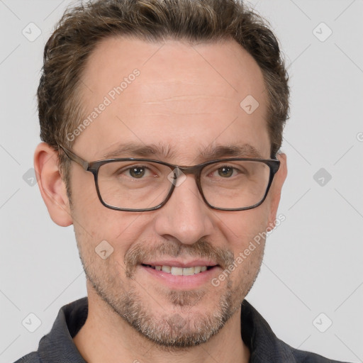 Joyful white adult male with short  brown hair and grey eyes