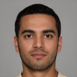 Neutral latino young-adult male with short  brown hair and brown eyes