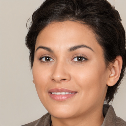 Joyful white young-adult female with medium  brown hair and brown eyes