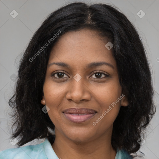 Joyful black young-adult female with medium  brown hair and brown eyes