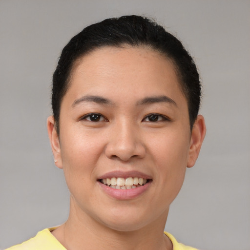 Joyful asian young-adult female with short  brown hair and brown eyes