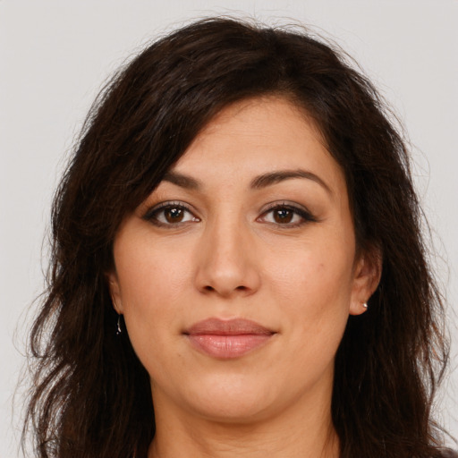 Joyful white young-adult female with long  brown hair and brown eyes
