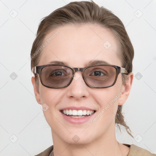 Joyful white young-adult female with medium  brown hair and blue eyes