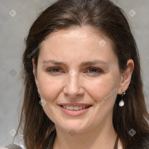 Joyful white adult female with medium  brown hair and grey eyes