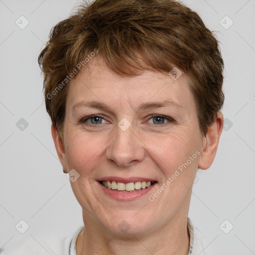 Joyful white adult female with short  brown hair and grey eyes