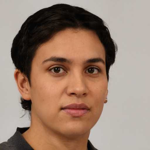 Neutral white young-adult female with short  black hair and brown eyes