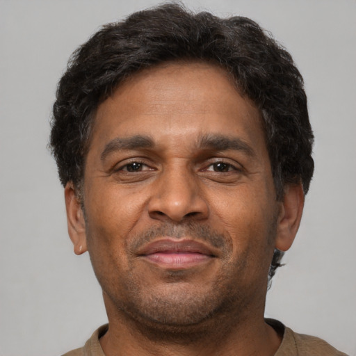 Neutral latino adult male with short  brown hair and brown eyes