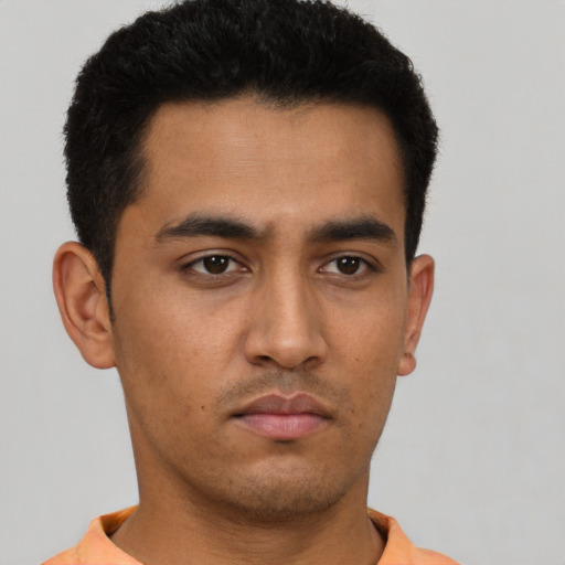 Neutral latino young-adult male with short  black hair and brown eyes