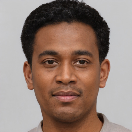 Neutral black young-adult male with short  black hair and brown eyes