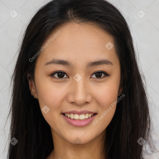 Joyful asian young-adult female with long  brown hair and brown eyes