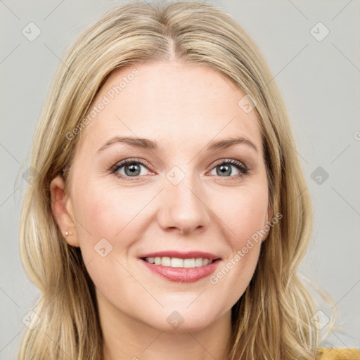 Joyful white young-adult female with long  brown hair and blue eyes