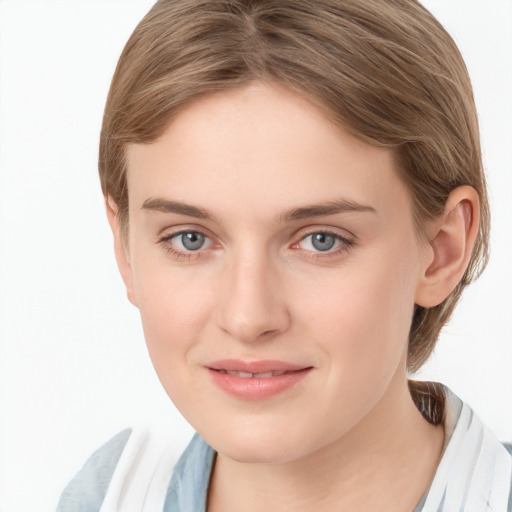 Joyful white young-adult female with medium  brown hair and blue eyes