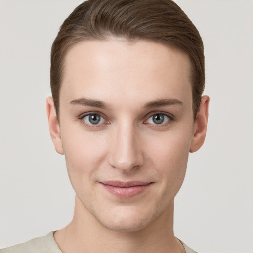 Joyful white young-adult female with short  brown hair and grey eyes