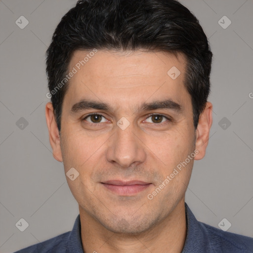 Joyful white adult male with short  black hair and brown eyes