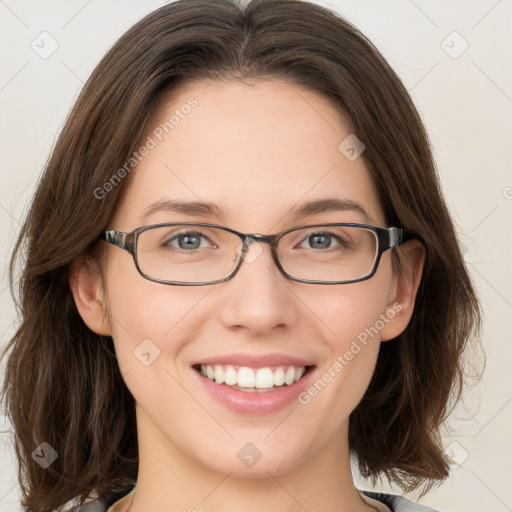 Joyful white young-adult female with medium  brown hair and green eyes