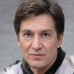 Joyful white middle-aged male with short  brown hair and brown eyes