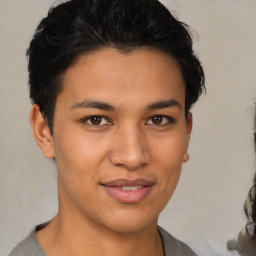 Joyful latino young-adult male with short  brown hair and brown eyes