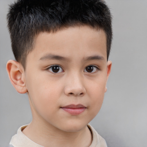 Joyful white child male with short  brown hair and brown eyes