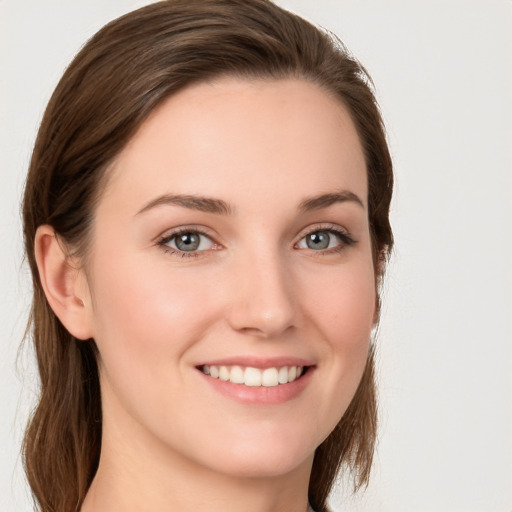 Joyful white young-adult female with long  brown hair and grey eyes