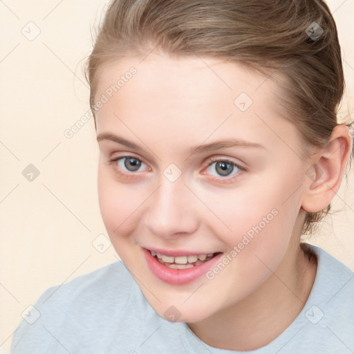 Joyful white child female with medium  brown hair and brown eyes