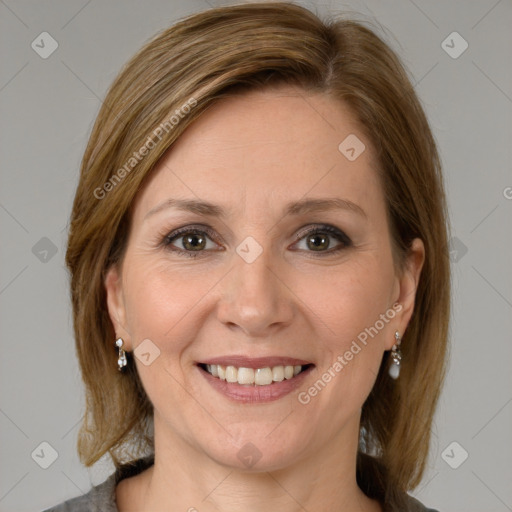 Joyful white adult female with medium  brown hair and grey eyes