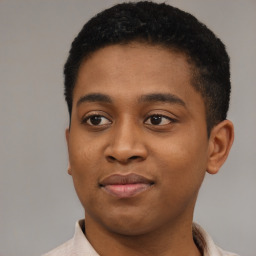 Joyful black young-adult male with short  brown hair and brown eyes