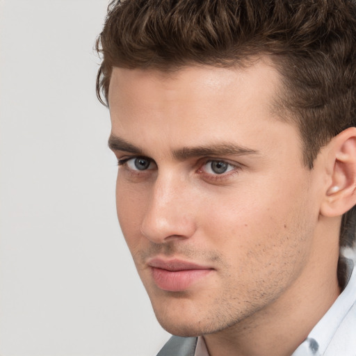 Neutral white young-adult male with short  brown hair and grey eyes