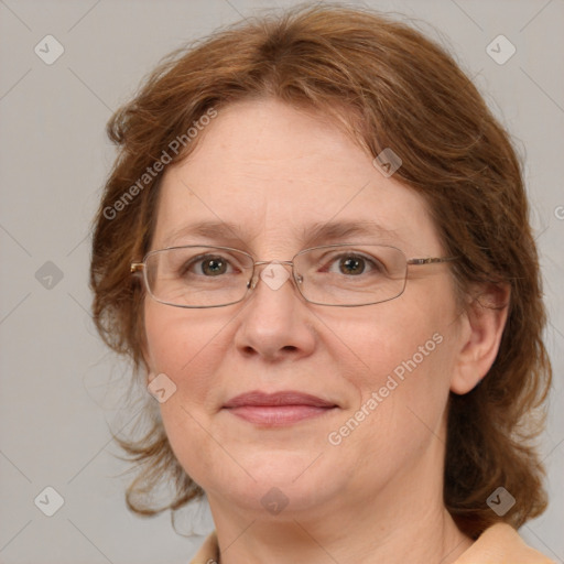 Joyful white adult female with medium  brown hair and blue eyes