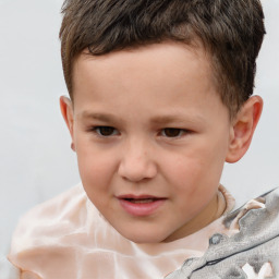 Joyful white child male with short  brown hair and brown eyes