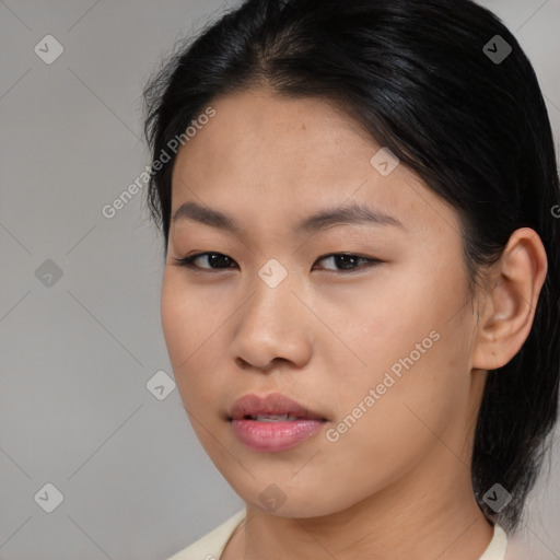 Neutral asian young-adult female with medium  brown hair and brown eyes