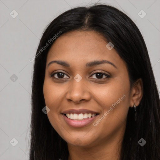 Joyful latino young-adult female with long  black hair and brown eyes