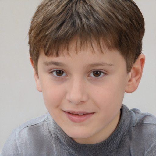 Joyful white child male with short  brown hair and brown eyes