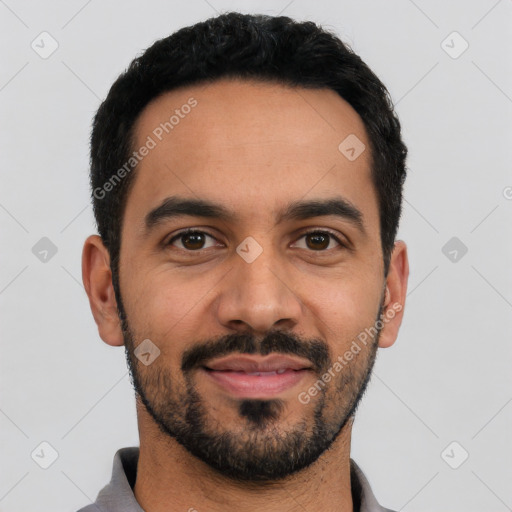 Joyful latino young-adult male with short  black hair and brown eyes