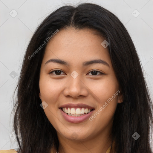 Joyful asian young-adult female with long  brown hair and brown eyes