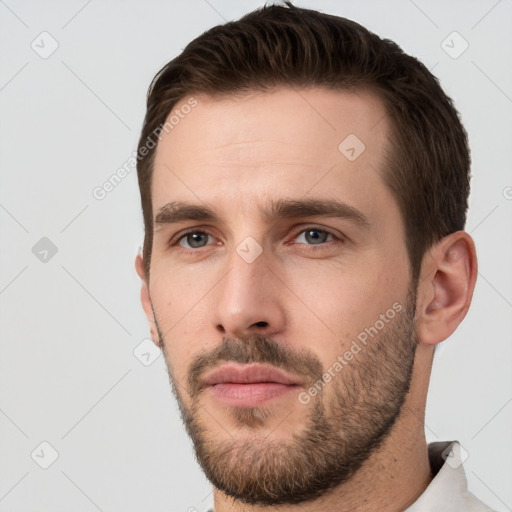 Neutral white young-adult male with short  brown hair and brown eyes