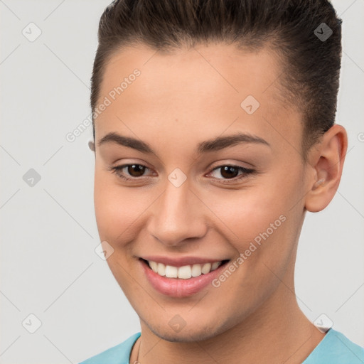 Joyful white young-adult female with short  brown hair and brown eyes