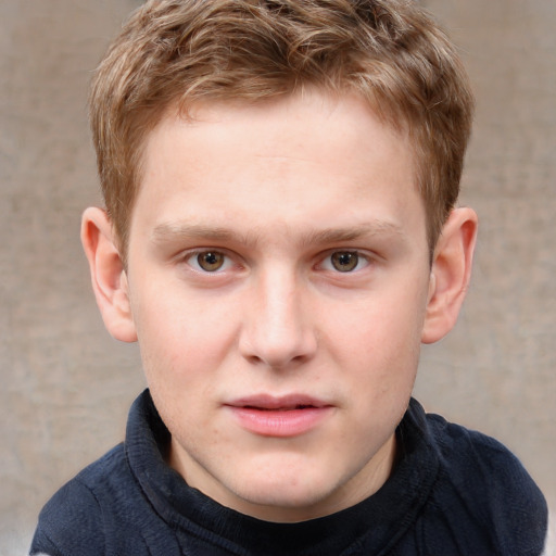 Joyful white child male with short  brown hair and grey eyes