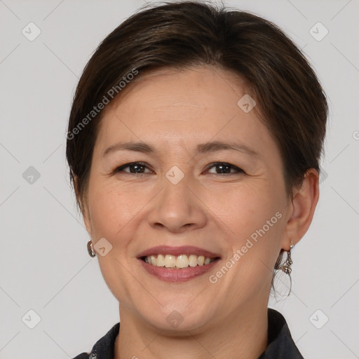 Joyful white adult female with medium  brown hair and brown eyes