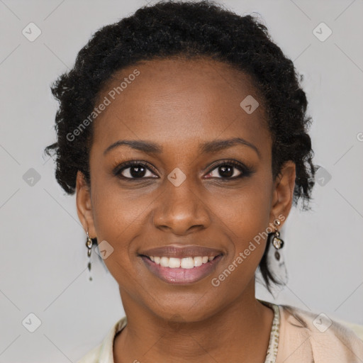 Joyful black young-adult female with short  brown hair and brown eyes