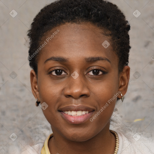 Joyful black young-adult female with short  brown hair and brown eyes