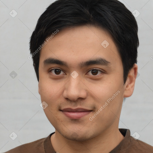 Joyful asian young-adult male with short  black hair and brown eyes