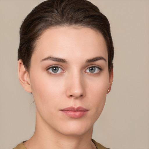 Neutral white young-adult female with short  brown hair and brown eyes